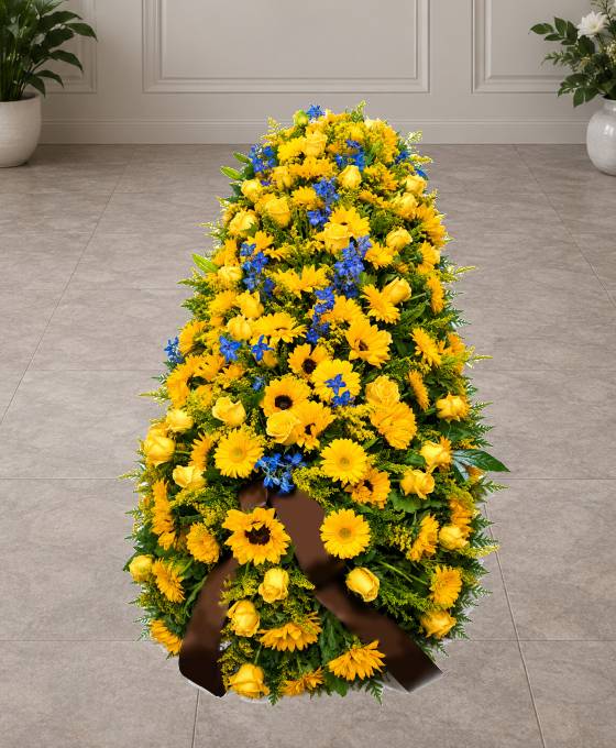 Cofano funebre di fiori gialli e blu