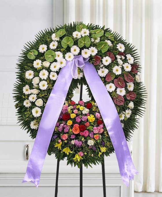 Corona funebre di anthurium verdi e gerbera bianca
