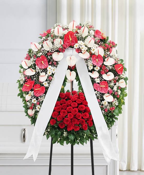 Corona funebre di fiori bianchi e rossi
