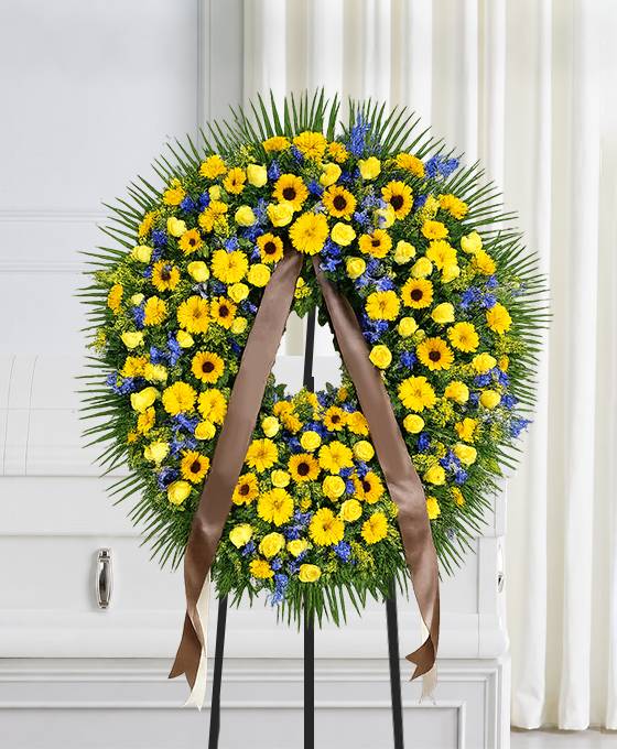 Corona funebre di fiori gialli e blu