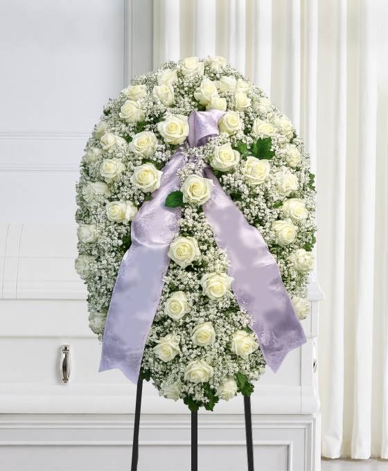 Mezzo cofano funebre di rose bianche e gisofila